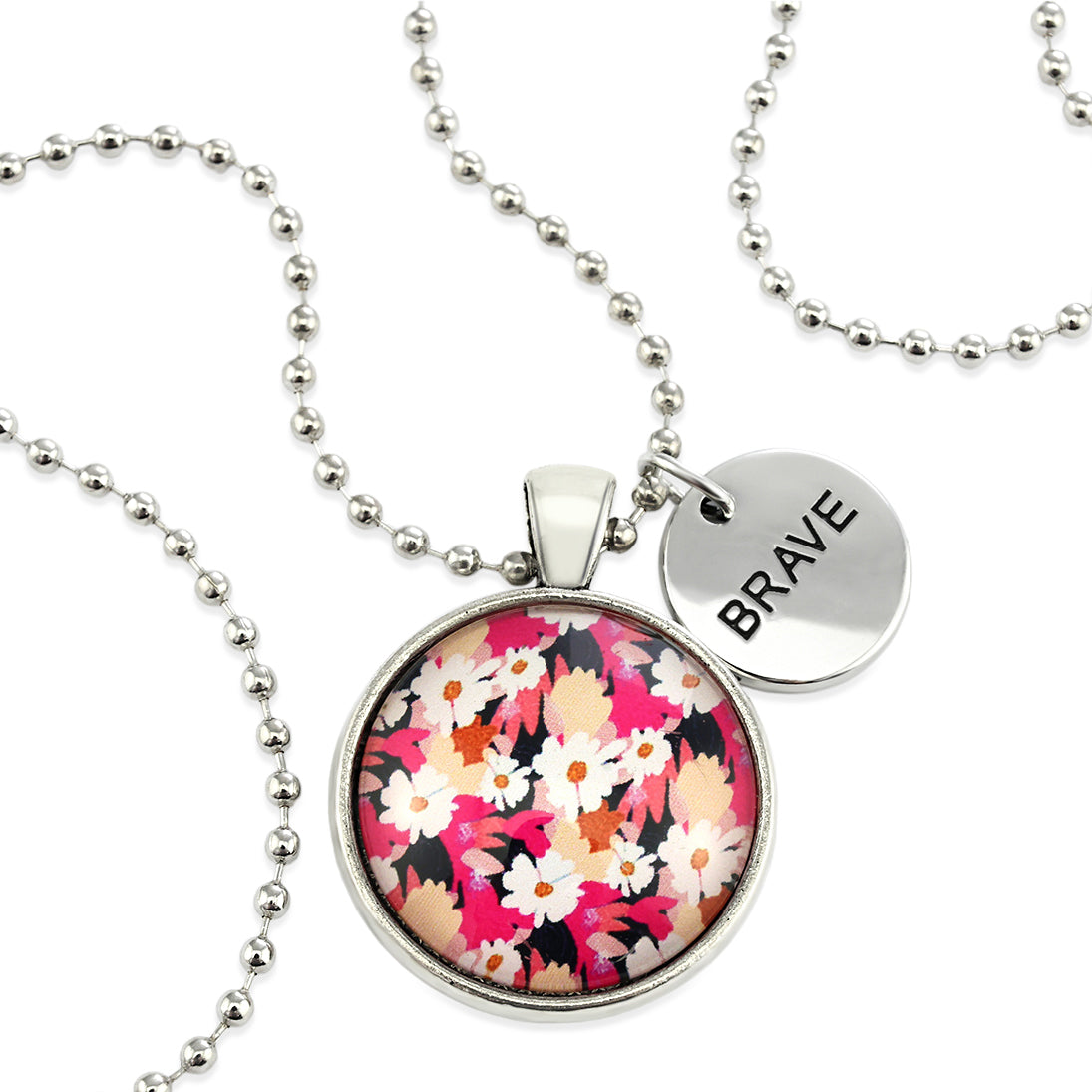 Circle pendant necklace in vintage silver with 'BRAVE' charm, bright pink floral print. Fundraiser for the national breast cancer foundation.