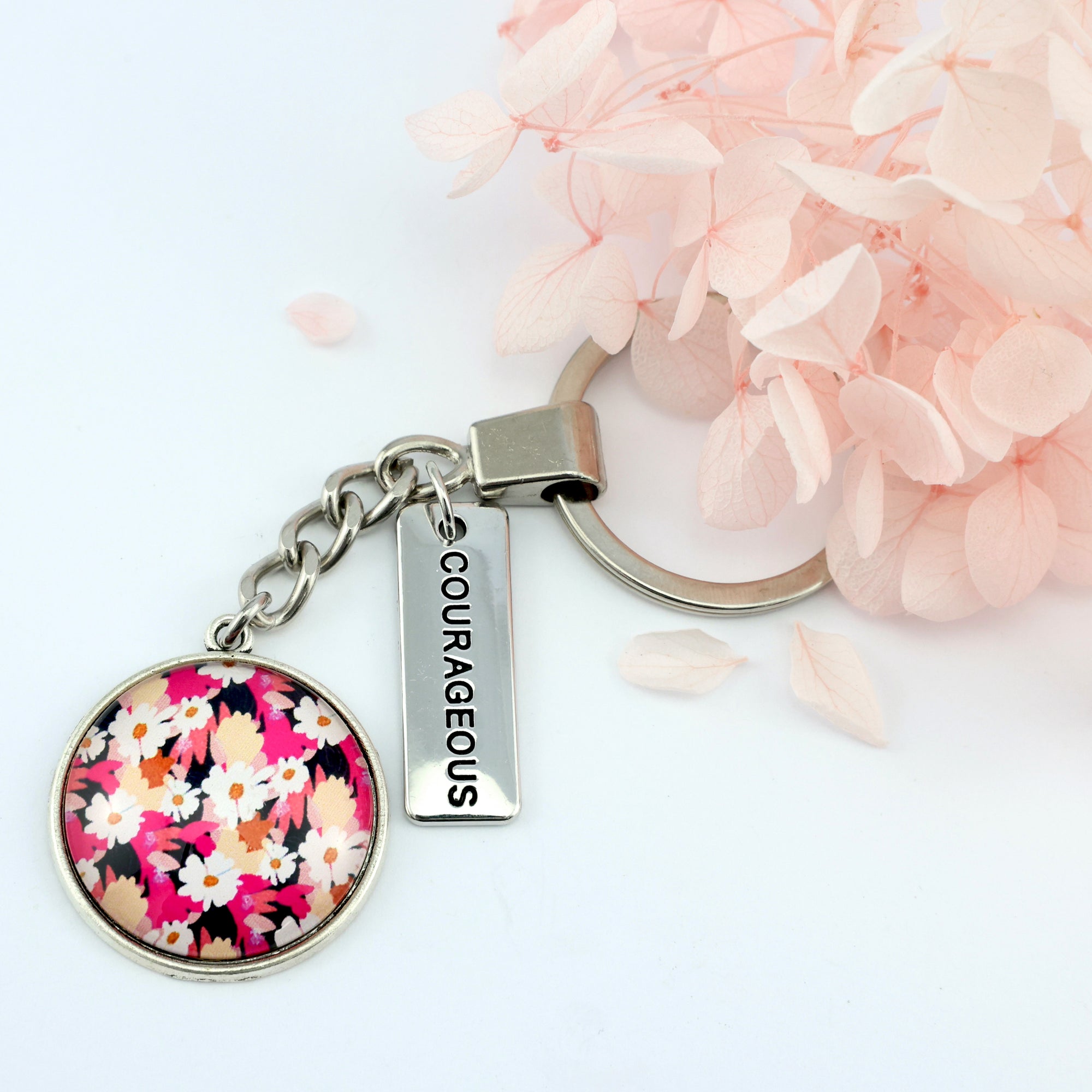 Circle pendant keychain in vintage silver with 'courageous' charm, bright pink floral print. Fundraiser for the national breast cancer foundation.