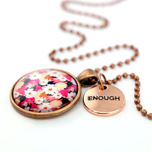 Circle pendant necklace in vintage copper with 'enough' charm, bright pink floral print. Fundraiser for the national breast cancer foundation.