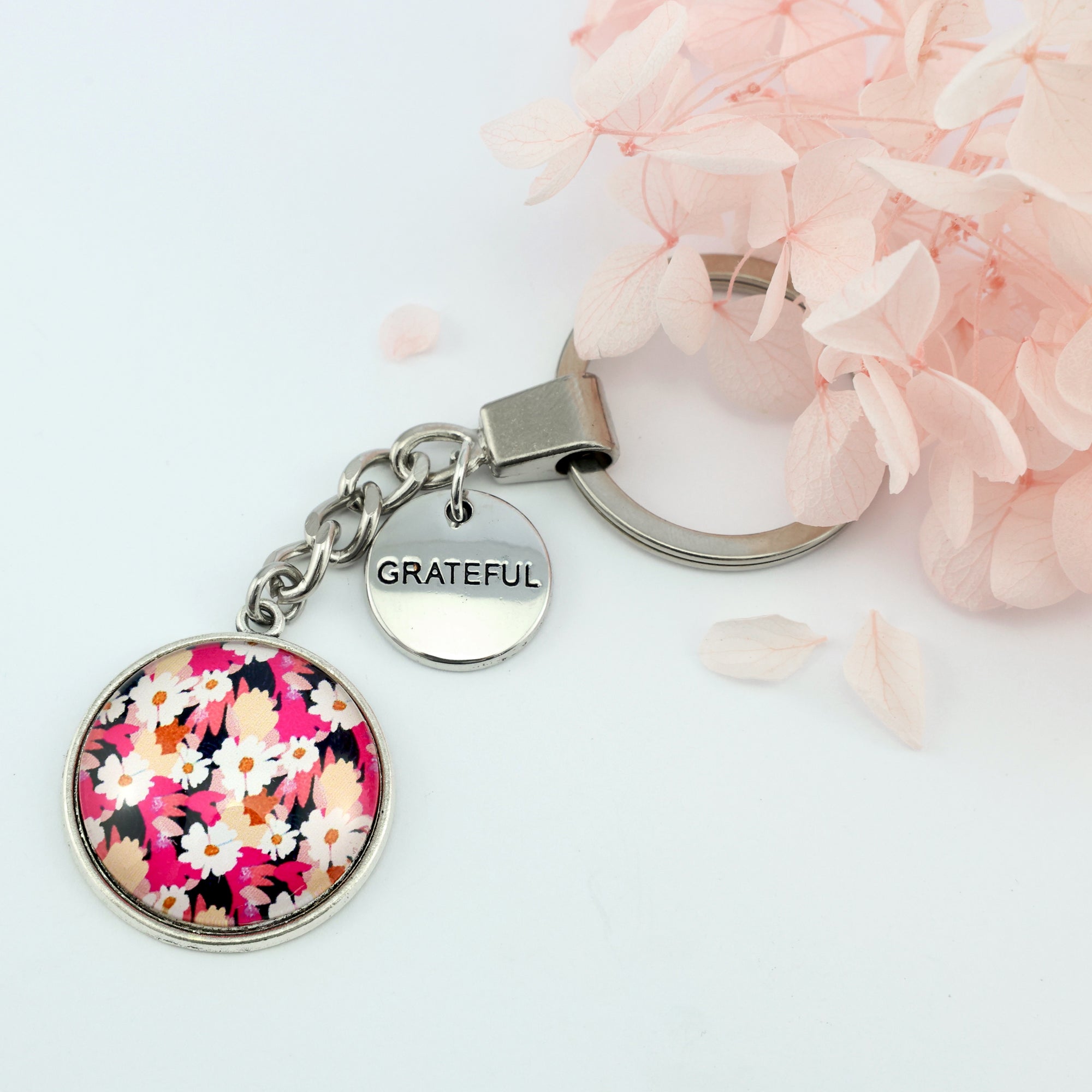 Circle pendant keychain in vintage silver with 'grateful' charm, bright pink floral print. Fundraiser for the national breast cancer foundation.