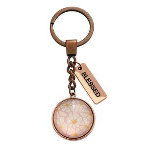 Circle pendant keychain in vintage copper with 'blessed' charm, floral print. Fundraiser for the national breast cancer foundation.