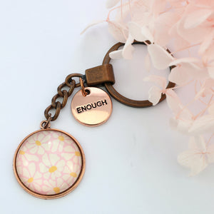 Circle pendant keychain in vintage copper with 'enough' charm, floral print. Fundraiser for the national breast cancer foundation.