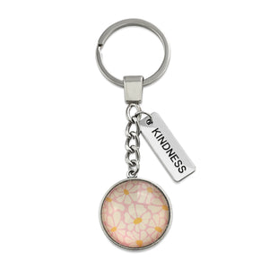 Circle pendant keychain in vintage silver with 'kindness' charm, floral print. Fundraiser for the national breast cancer foundation.