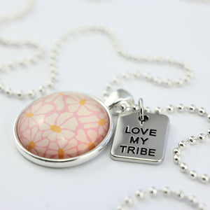 Circle pendant necklace in silver with 'love my tribe' charm, floral print. Fundraiser for the national breast cancer foundation.