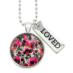 Pink print silver circle pendant necklace with ball chain and 'Loved' charm. This product is raising money for the National Breast Cancer Foundation. 