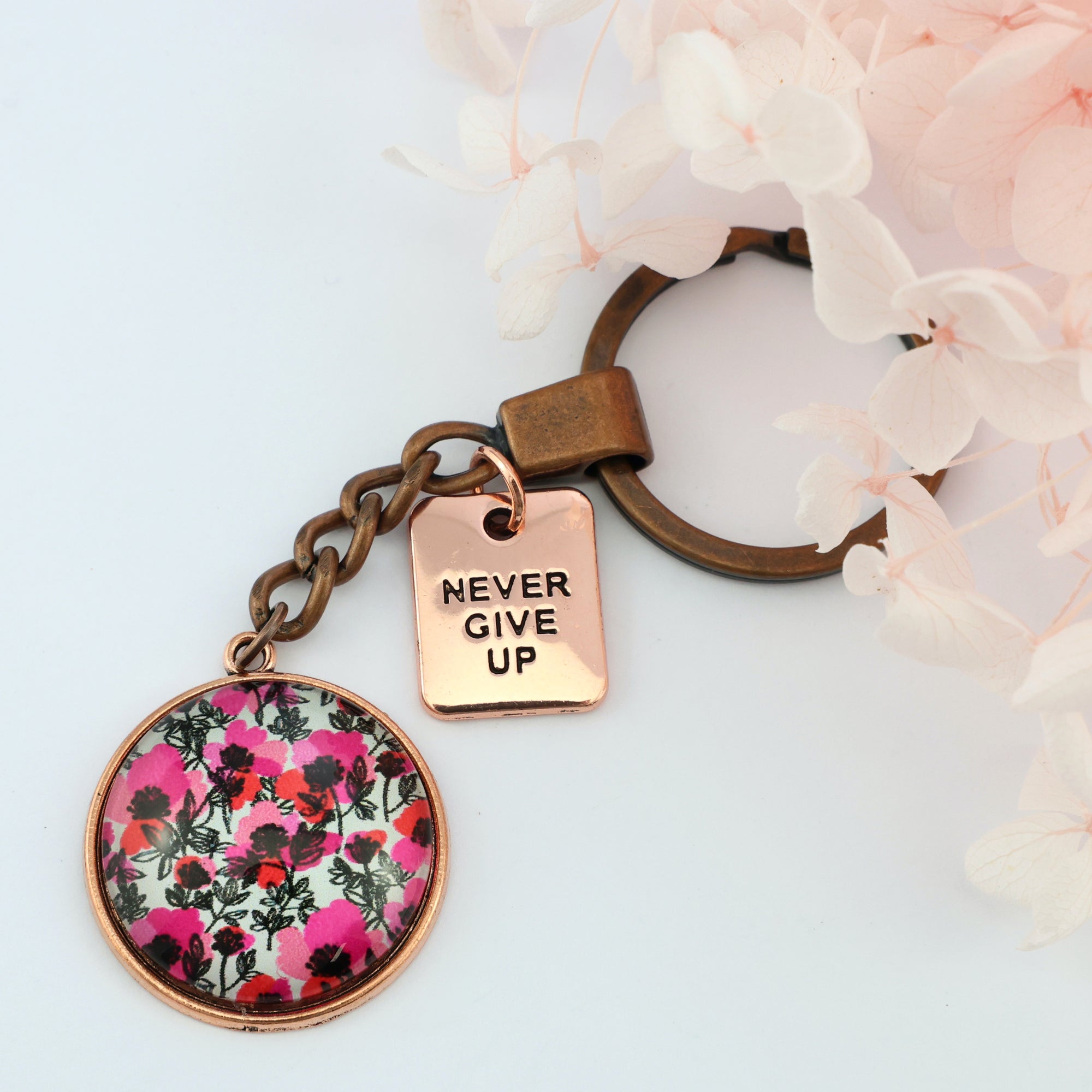 Pink print vintage copper red keychain circle pendant 'Never Give Up' charm. This product is raising money for the National Breast Cancer Foundation. 