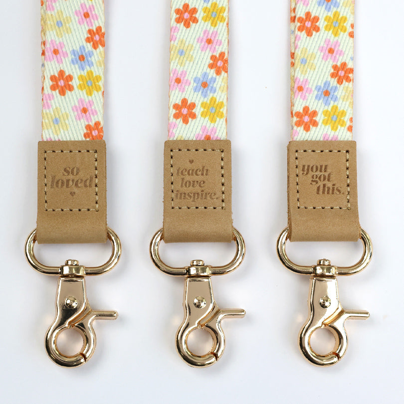 cream floral teacher lanyard with gold clip. Choose from so loved, teach love inspire or you got this. 