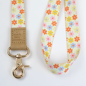 cream floral teacher lanyard with gold clip. Choose from so loved, teach love inspire or you got this. 