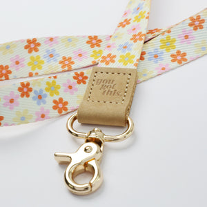 cream floral teacher lanyard with gold clip. Choose from so loved, teach love inspire or you got this. 