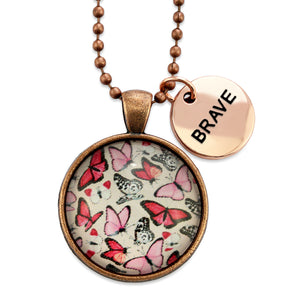 Pink floral print circle vintage red copper pendant necklace with ball chain with rose gold circle shape 'brave' charm. Fundraising product for the National Breast Cancer Foundation. 