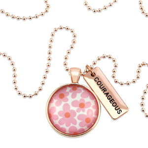 Pink floral print rose gold circle pendant necklace with 'courageous' charm. A product that fundraises for the National Breast Cancer Foundation. 