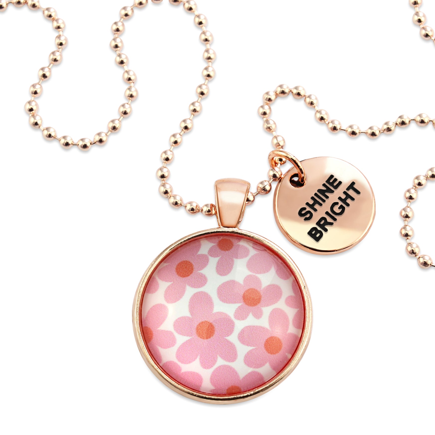 Pink floral print rose gold circle pendant necklace with 'courageous' charm. A product that fundraises for the National Breast Cancer Foundation. 