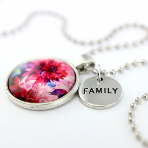 Pink floral print silver circle pendant necklace with 'family' charm. A product that fundraises for the National Breast Cancer Foundation. 