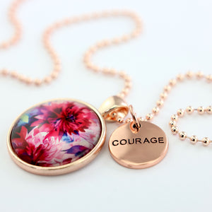 Pink floral print rose gold circle pendant necklace with 'courage' charm. A product that fundraises for the National Breast Cancer Foundation. 