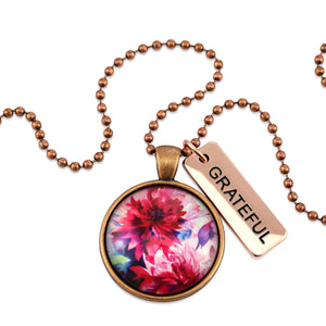 Pink floral print vintage red copper circle pendant necklace with rose gold 'grateful' charm. A product that fundraises for the National Breast Cancer Foundation. 