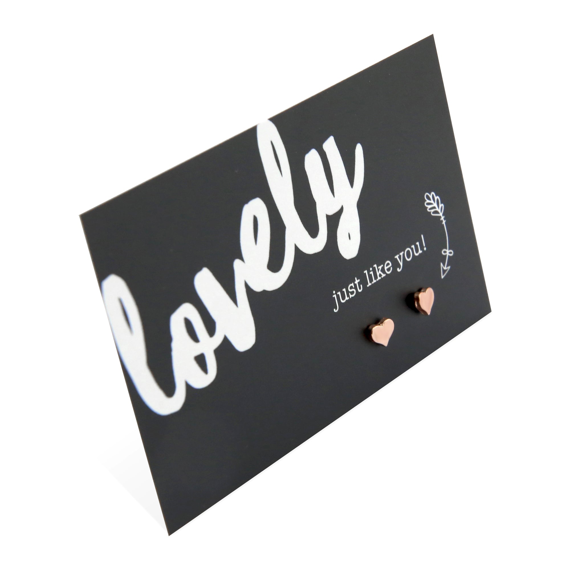 Tiny heart shaped earring stud on a card that says 'Lovely just like you' materials are plated zinc alloy. 