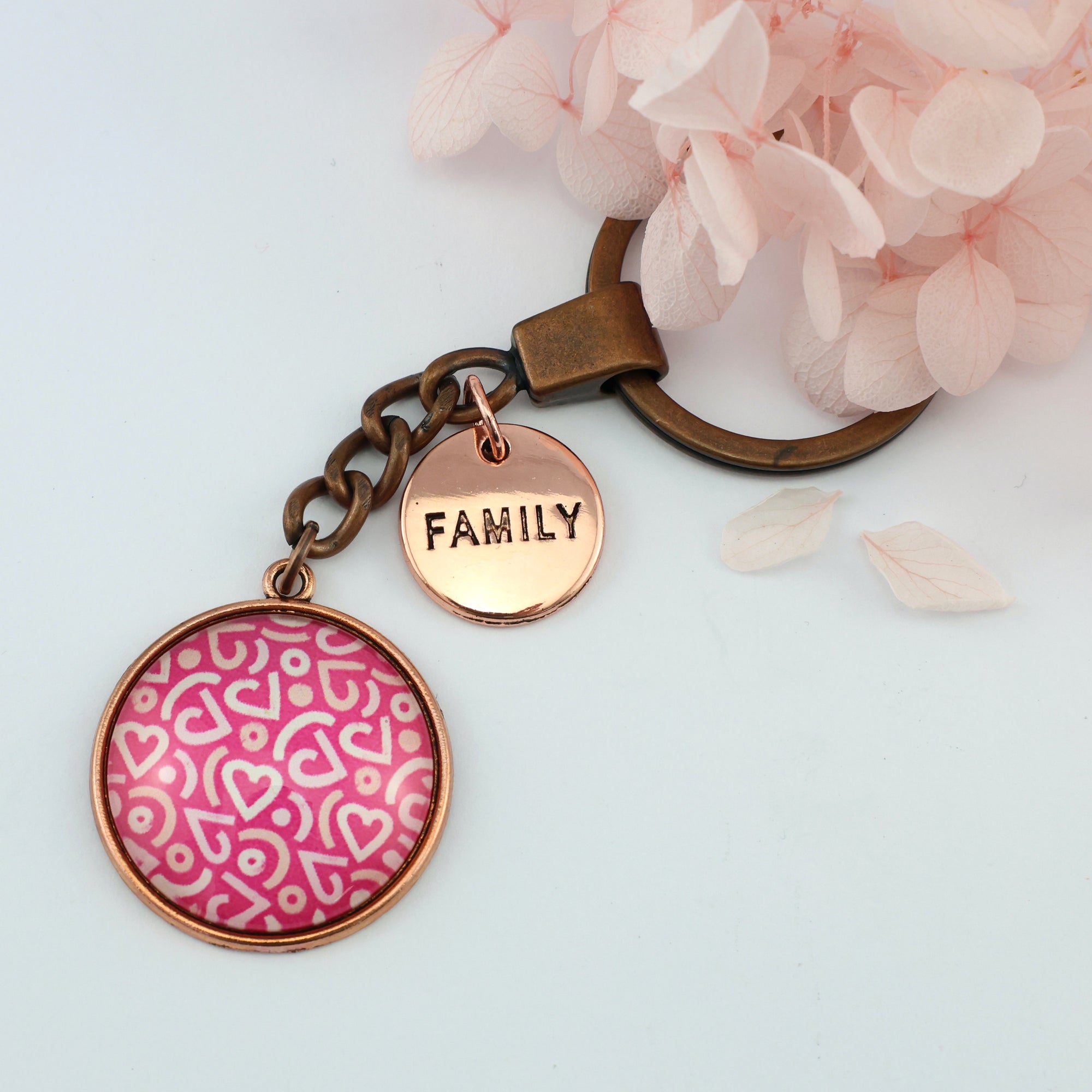 Pink floral print vintage copper circle pendant keychain with 'Family' charm. A product that fundraises for the National Breast Cancer Foundation. 