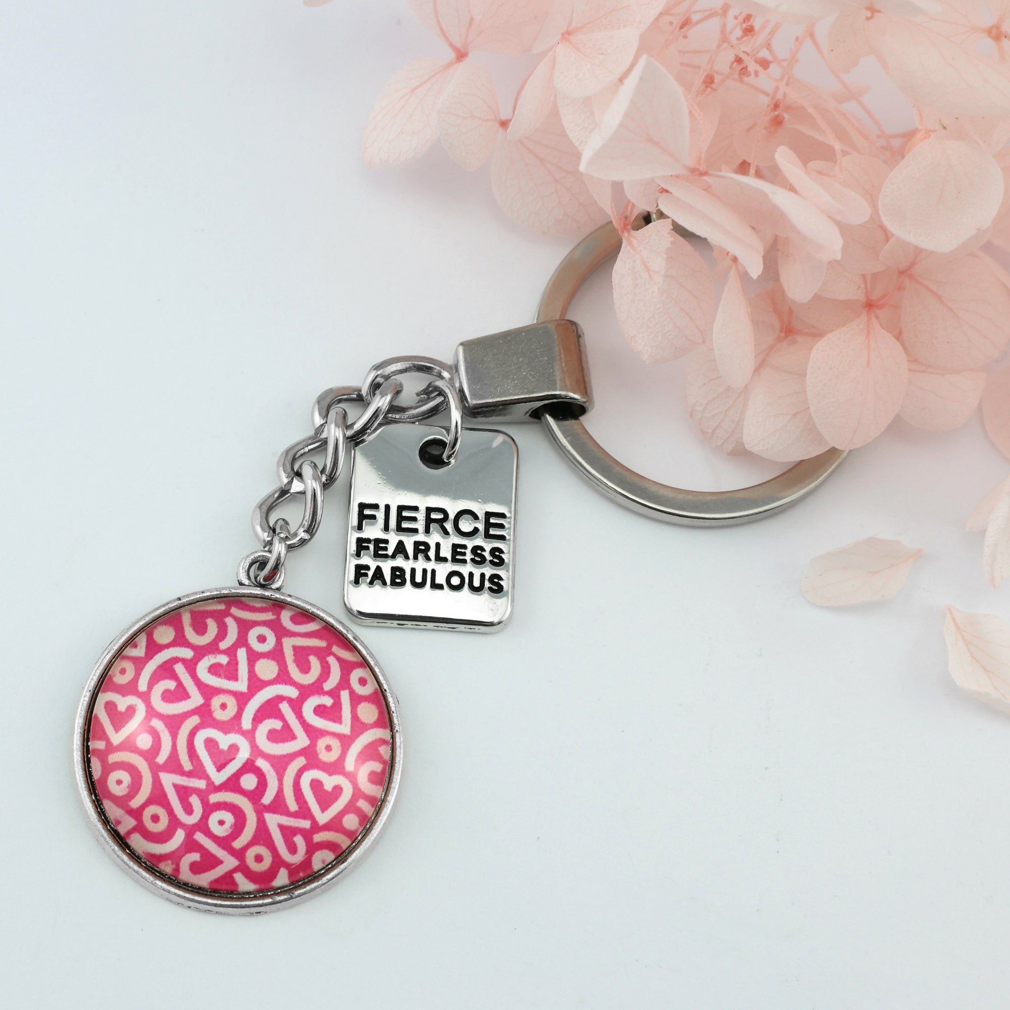 Pink heart print silver keychain pendant with Fierce Fearless Fabulous charm. A fundraising product for the national breast cancer foundation. 