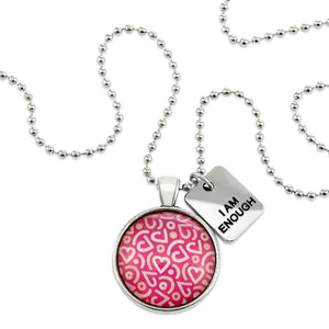 Pink heart print silver circle pendant necklace with 'I Am Enough' charm. A fundraising product for the national breast cancer foundation. 