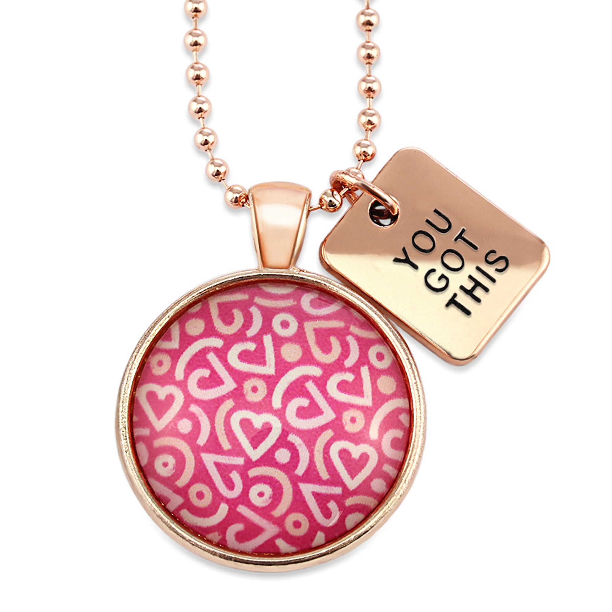 Pink heart print silver necklace circle pendant with 'you got this' charm. A fundraising product for the national breast cancer foundation. 