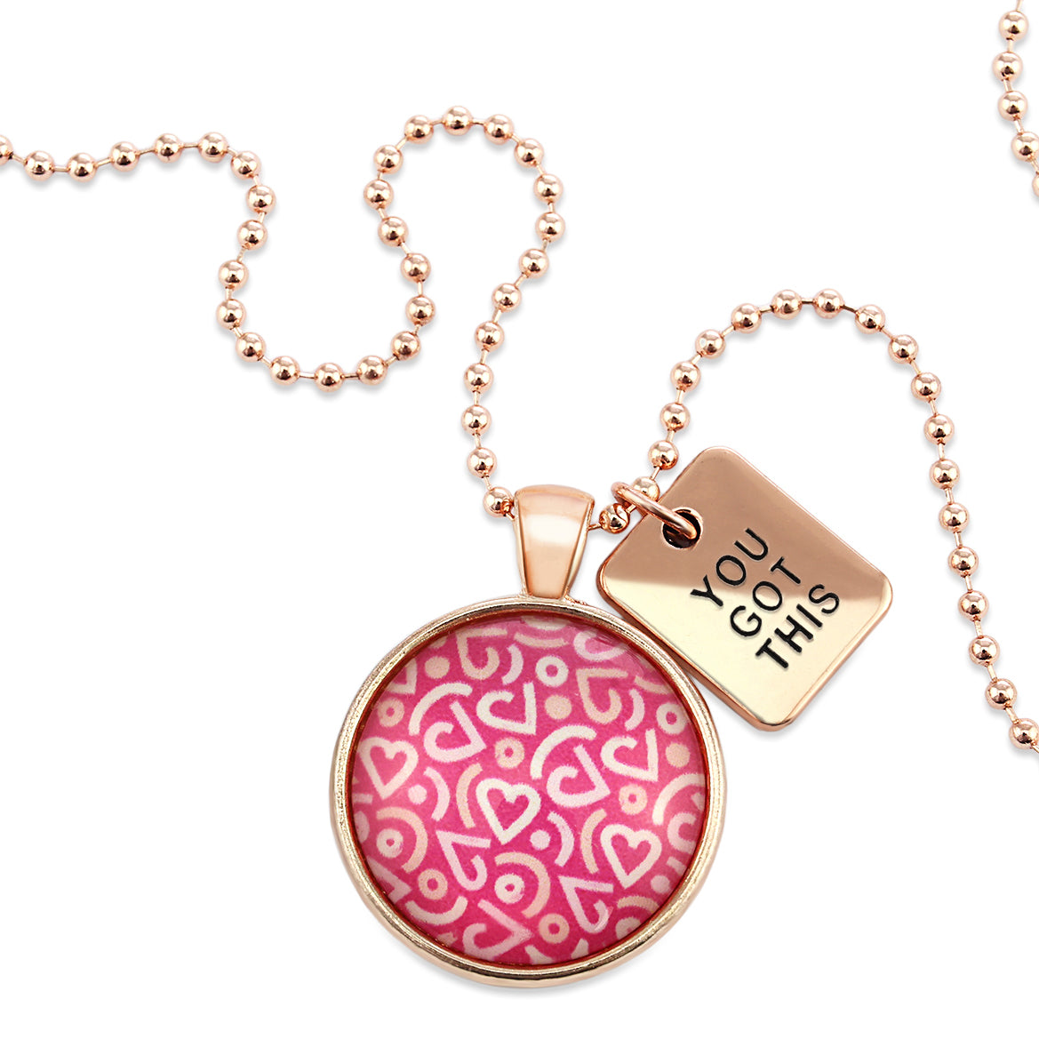 Pink heart print silver necklace circle pendant with 'you got this' charm. A fundraising product for the national breast cancer foundation. 