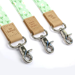 Mint green floral teacher lanyard with gold clip. Choose from so loved, teach love inspire or you got this. 