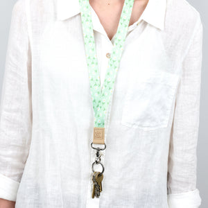 Mint green floral teacher lanyard with gold clip. Choose from so loved, teach love inspire or you got this. 