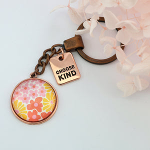 Pink floral print circle pendant vintage silver keychain with 'Choose Kind' word charm. Fundraising product for the National Breast Cancer Foundation. 