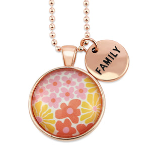 Pink floral print circle pendant silver ball chain necklace with rose gold 'family' word charm. Fundraising product for the National Breast Cancer Foundation. 