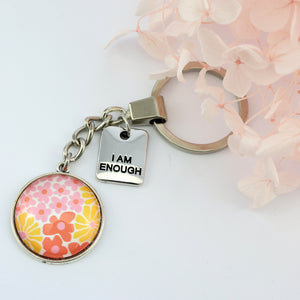 Pink floral print circle pendant vintage silver keychain with 'I Am Enough word charm. Fundraising product for the National Breast Cancer Foundation. 