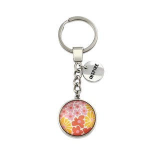 Pink floral print circle pendant vintage silver keychain with 'Inspire' word charm. Fundraising product for the National Breast Cancer Foundation. 