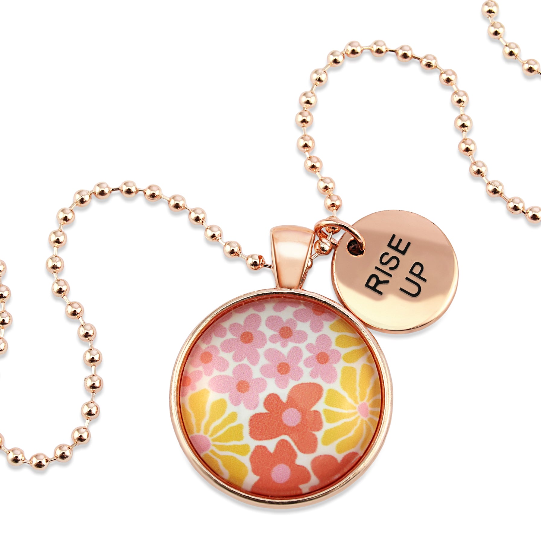 Pink floral print circle pendant silver ball chain necklace with rose gold 'rise up' word charm. Fundraising product for the National Breast Cancer Foundation. 