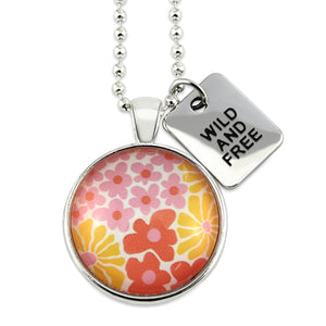 Pink floral print circle pendant silver ball chain necklace with SILVER 'wild and free' word charm. Fundraising product for the National Breast Cancer Foundation. 