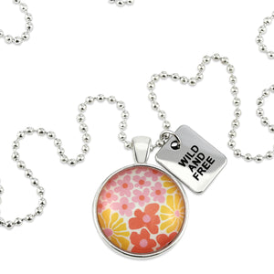 Pink floral print circle pendant silver ball chain necklace with SILVER 'wild and free' word charm. Fundraising product for the National Breast Cancer Foundation. 