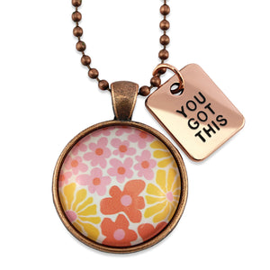 Pink floral print circle pendant vintage copper ball chain necklace with rose gold 'you got this' word charm. Fundraising product for the National Breast Cancer Foundation. 