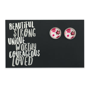 Pink floral print earring studs with silver sound on inspirational card. A product that raises money for the national breast cancer foundation. 