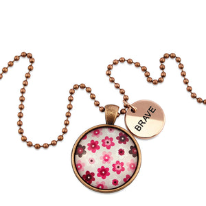 Pink floral print circle pendant vintage red copper ball chain necklace with rose gold 'brave' word charm. Fundraising product for the National Breast Cancer Foundation. 