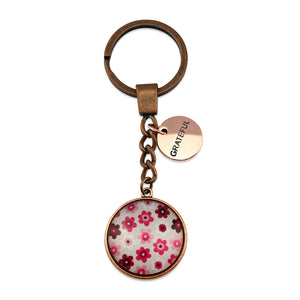 Pink floral print circle keychain pendant rose gold 'grateful' word charm. Fundraising product for the National Breast Cancer Foundation. 