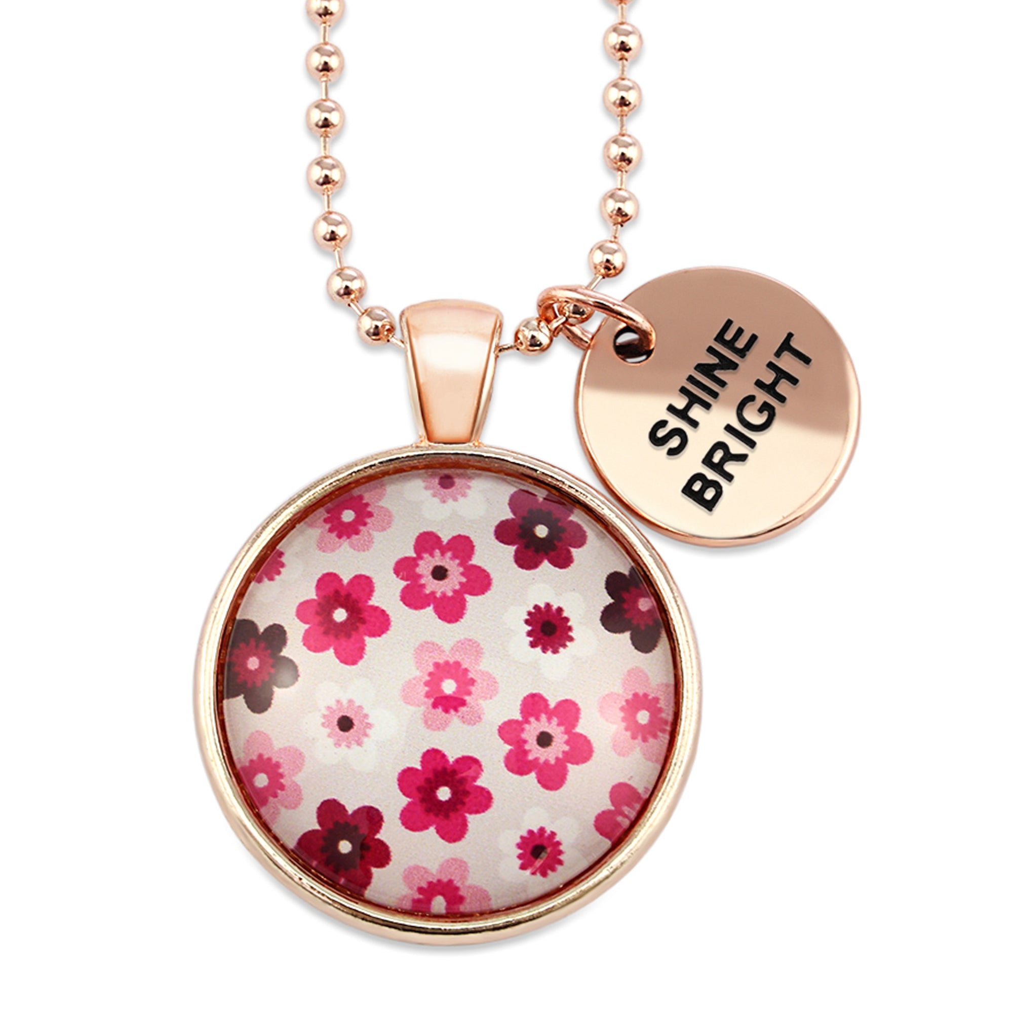 Pink floral print circle pendant rose gold ball chain necklace with rose gold 'shine bright' word charm. Fundraising product for the National Breast Cancer Foundation. 