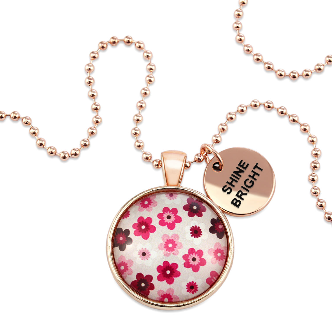 Pink floral print circle pendant rose gold ball chain necklace with rose gold 'shine bright' word charm. Fundraising product for the National Breast Cancer Foundation. 