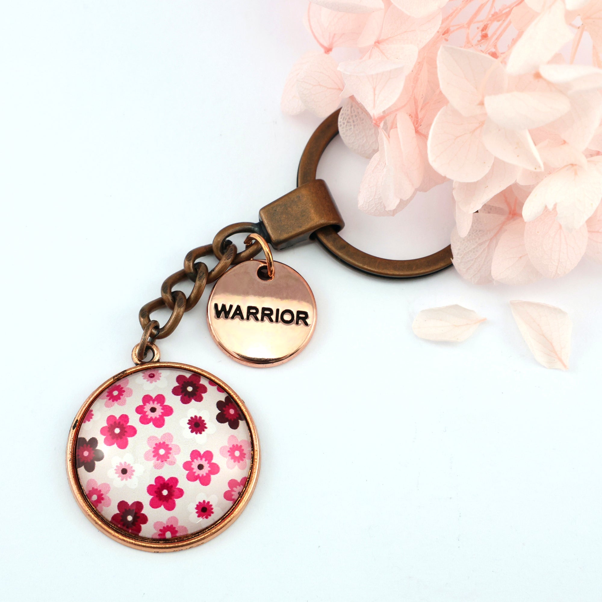 Pink floral print circle keychain pendant rose gold 'warrior' word charm. Fundraising product for the National Breast Cancer Foundation. 