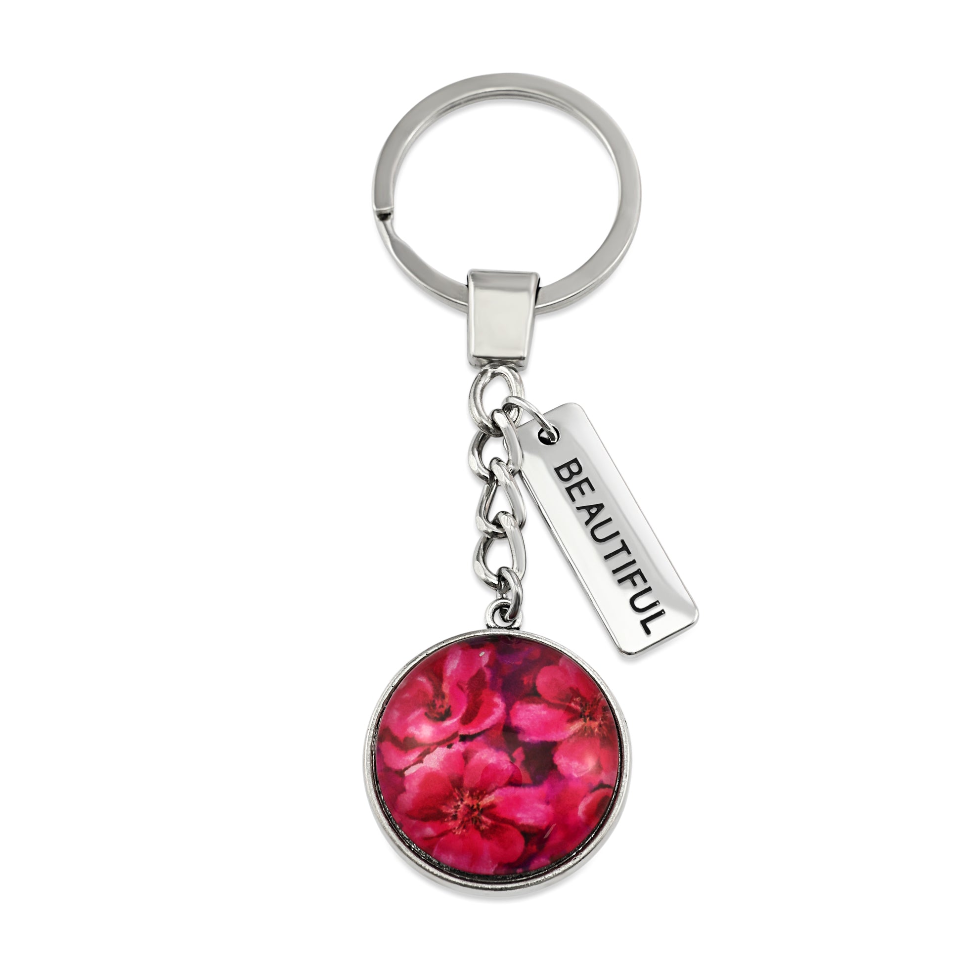 Circle pendant keyring in vintage silver with 'brave' charm, floral print. Fundraiser for the national breast cancer foundation.