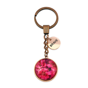 Circle pendant keyring in vintage red copper with rose gold 'brave' charm, floral print. Fundraiser for the national breast cancer foundation.