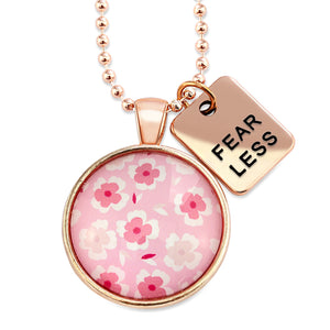 Pink floral print circle pendant rose gold ball chain necklace with rose gold 'fear less' word charm. Fundraising product for the National Breast Cancer Foundation. 