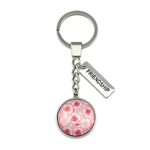 Circle pendant keyring in vintage silver with 'friendship ' charm, soft pink floral print. Fundraiser for the national breast cancer foundation.