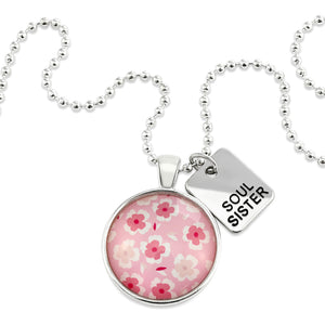 Pink floral print circle pendant silver ball chain necklace with silver 'soul sister' word charm. Fundraising product for the National Breast Cancer Foundation. 