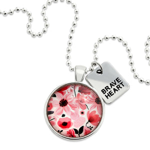 Pink floral print circle pendant silver ball chain necklace with silver 'brave heart' word charm. Fundraising product for the National Breast Cancer Foundation. 