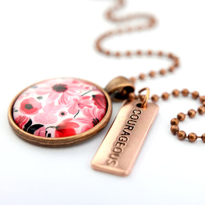 Pink floral print circle pendant vintage red  ball chain necklace with rose gold 'courageous' word charm. Fundraising product for the National Breast Cancer Foundation. 