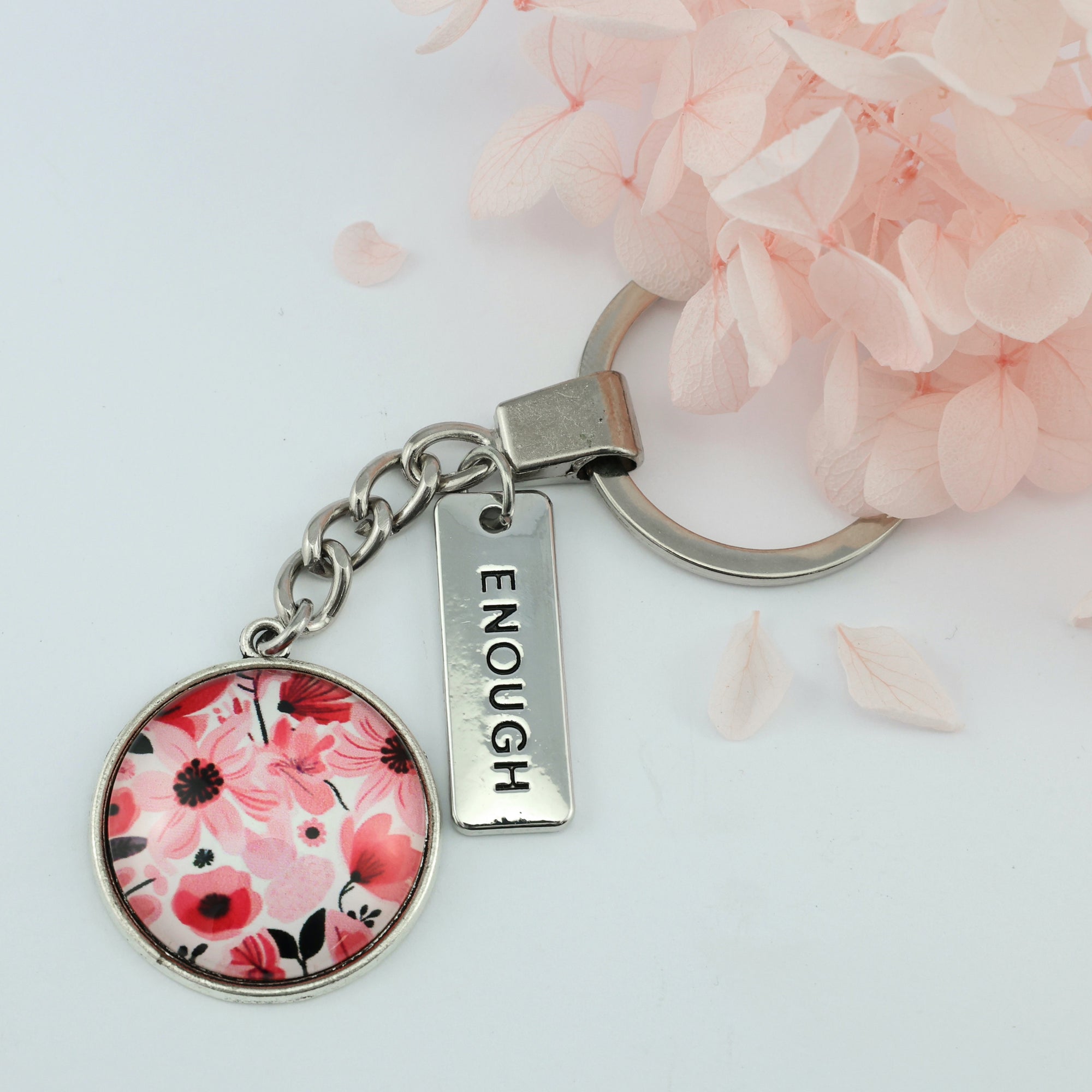 Circle pendant keychain in vintage silver with 'enough' charm, pop pink floral print. Fundraiser for the national breast cancer foundation.