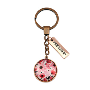 Circle pendant keyring in vintage copper with 'friendship' charm, pop pink floral print. Fundraiser for the national breast cancer foundation.